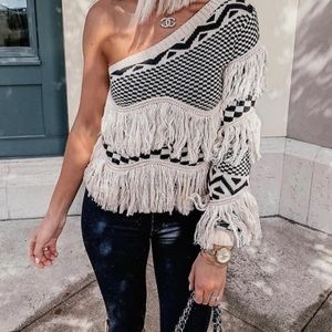 Black and cream fringe off the shoulder sweater.